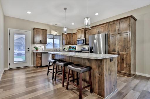 Kitchen features recessed lighting - oversized island - beautiful Alderwood cabinets