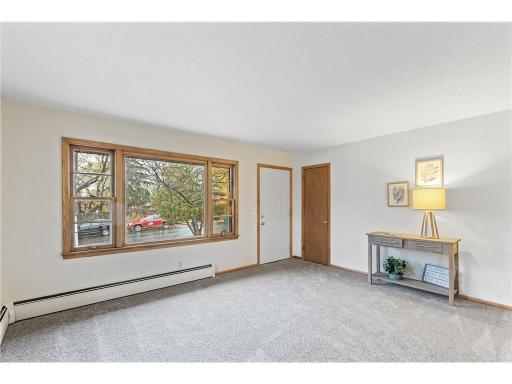 Unit 2 Front Entrance and Living Room with Continued Display of All the Natural Light Units have to Offer