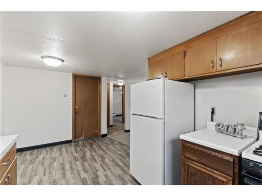 Unit 3 Kitchen, Dining, and Entrance to Living, Bed, and Bath areas