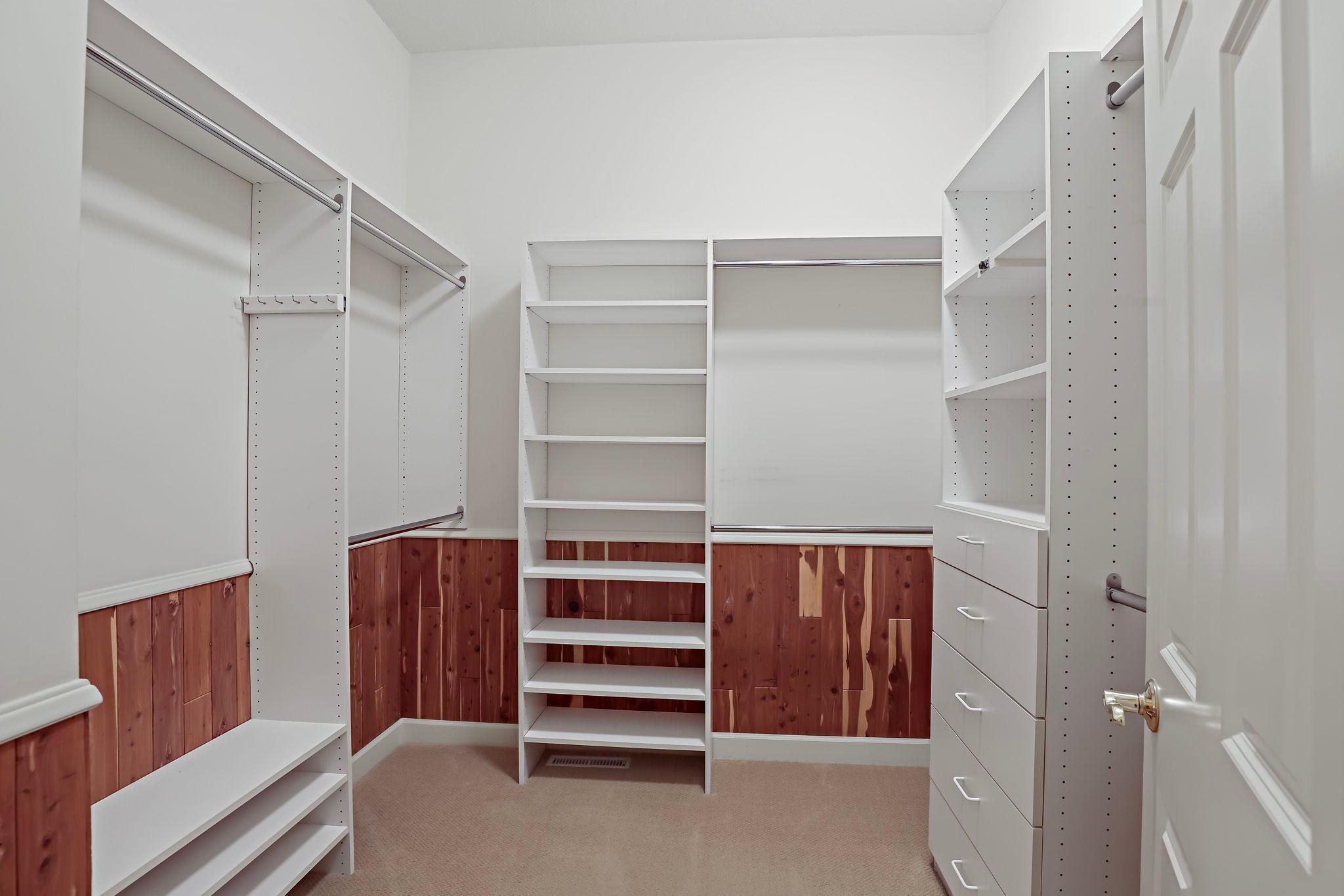 Primary walk-in closet.