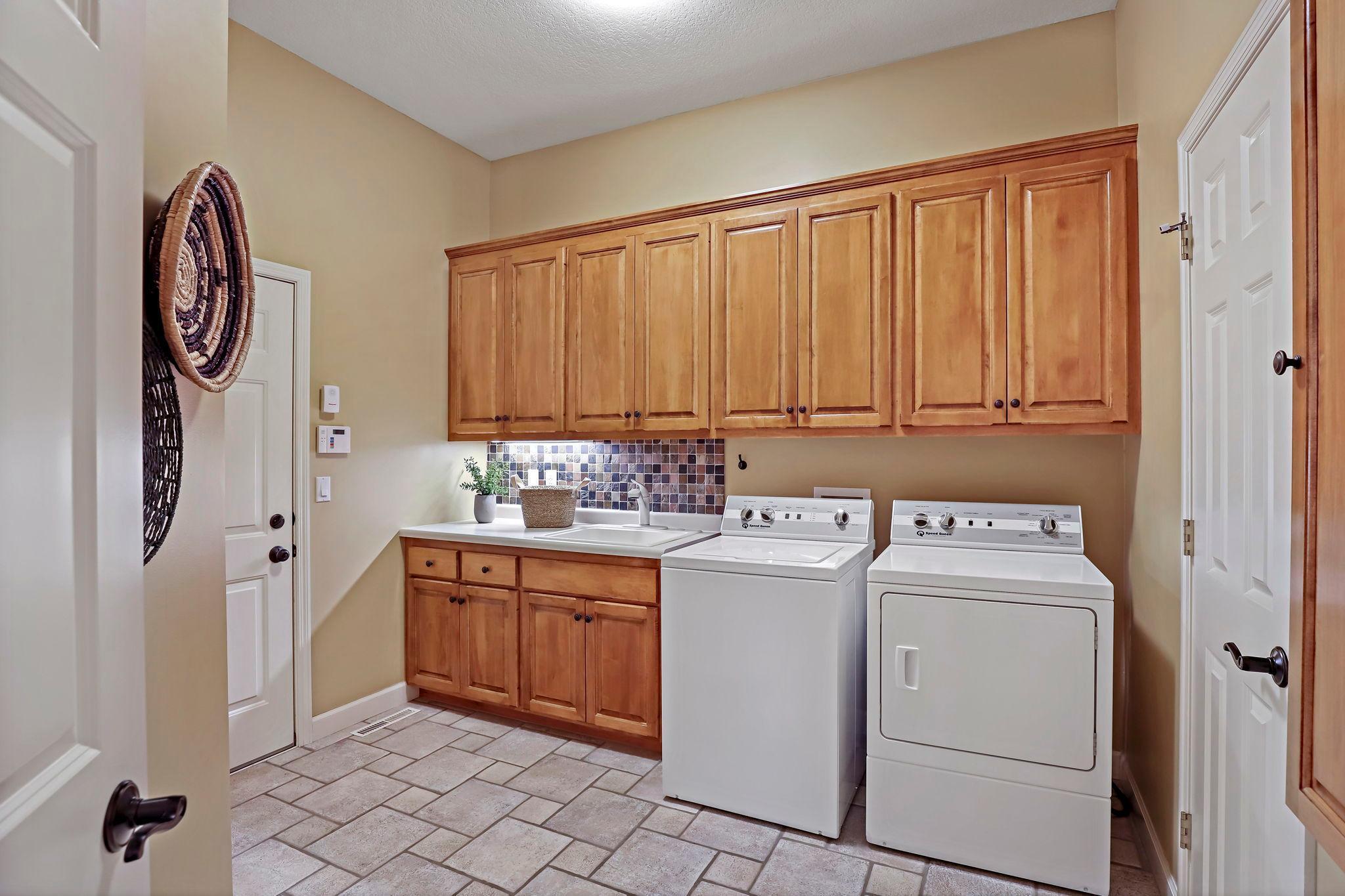 Laundry and mudroom off garage entrance.