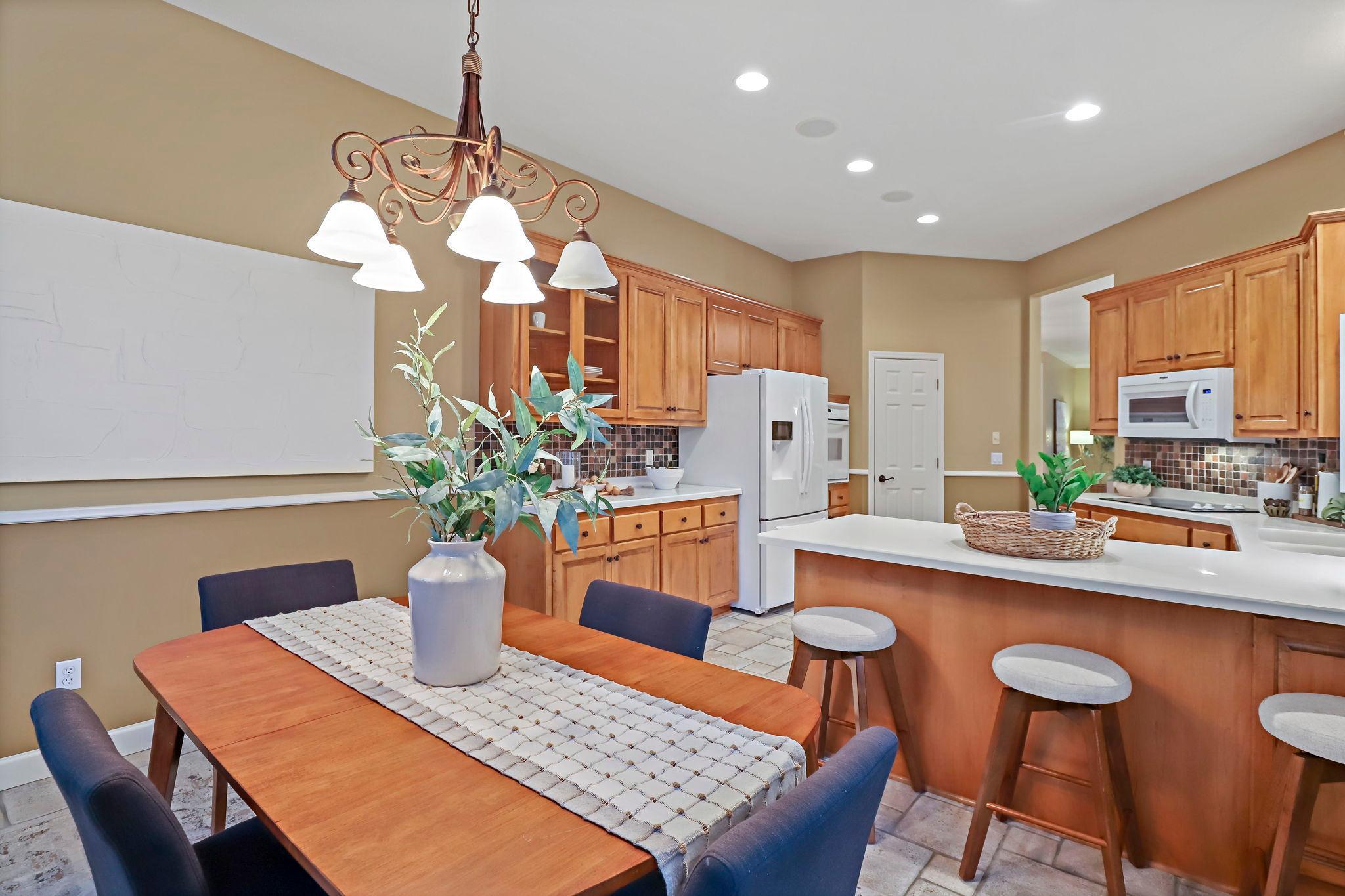 Island with stools and a full pantry.