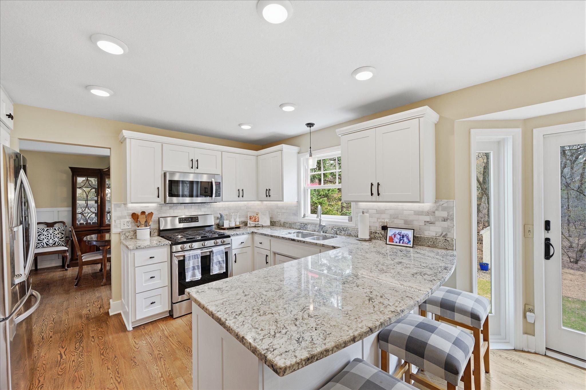 Great breakfast bar in the kitchen boasts LED under cabinet lighting