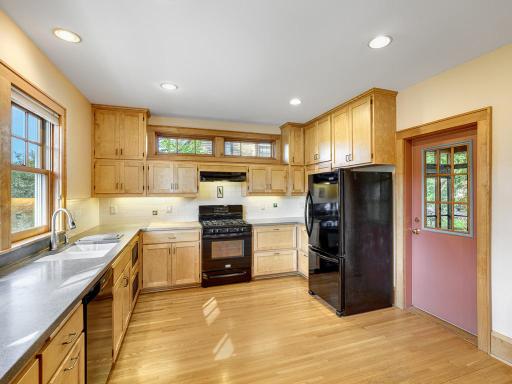 10 - Another view of the kitchen with a door to the screened in porch.