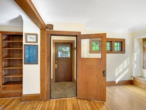 4 - Foyer w/rich natural oak woodwork and polished hardwood floors throughout.