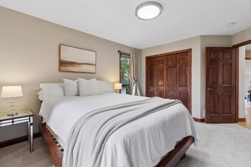 This main-level guest bedroom, offers comfort and privacy.