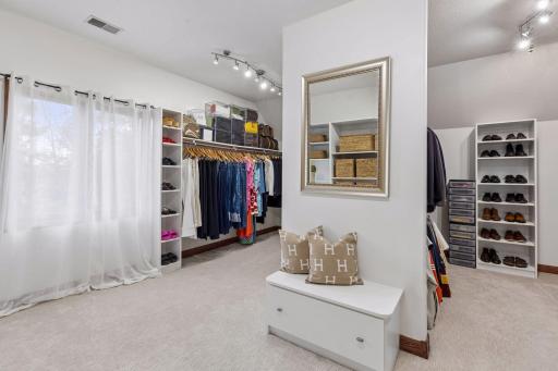 An oversized walk-in closet offers exceptional space, organization, and everyday luxury.