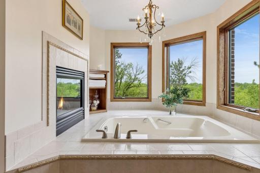 Unwind in the serene whirlpool tub surrounded by windows and peaceful natural light.