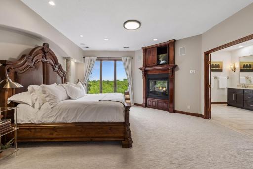 As you make your way to the upper level, French doors welcome you into the luxurious primary suite.