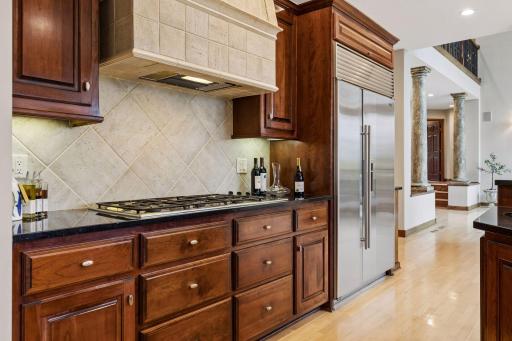 The Sub-Zero refrigerator adds a sleek touch to this beautifully designed gourmet kitchen.