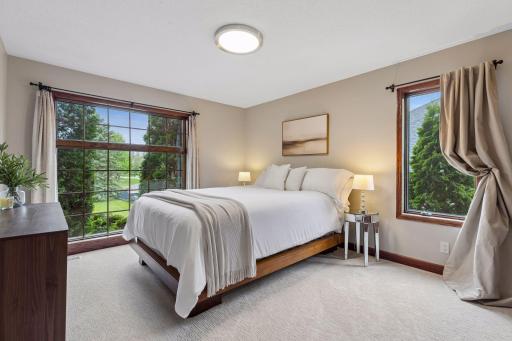 A beautifully appointed main-level guest bedroom.