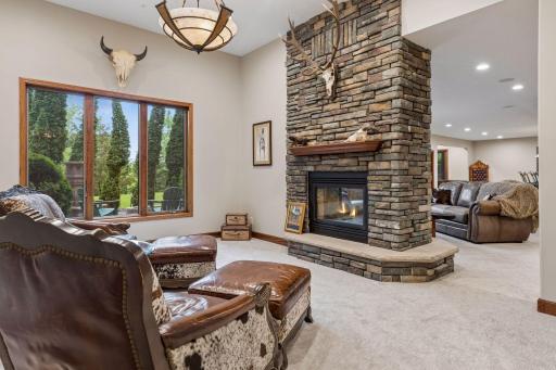 The stunning see-through fireplace creates a natural division within the lower level.