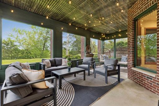 Walk out from the lower level to the three-season porch.