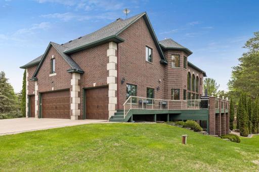 An expansive deck creates the perfect outdoor retreat for entertaining, relaxing, and taking in the surrounding views in luxury and comfort.
