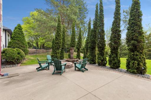 Gather around the firepit and enjoy cozy evenings in this thoughtfully designed outdoor retreat.