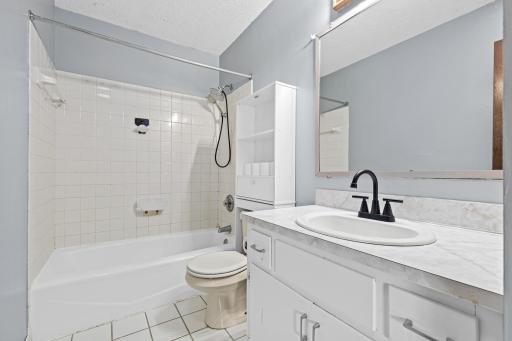 Full bathroom is convenient to both upper level bedrooms and all other living spaces making it ideal for guests and everyday use.