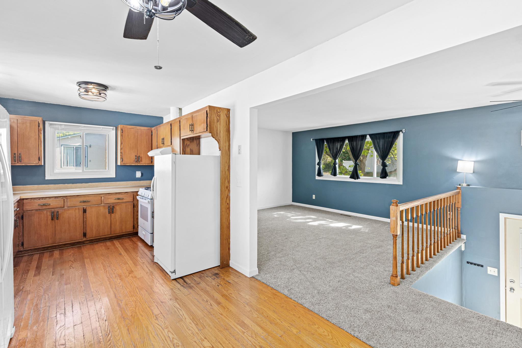 The upper level offers a seamless flow designed for both comfortable everyday living and easy entertaining.