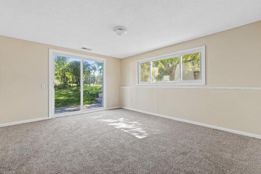 Downstairs, the walk-out lower level offers a spacious family room.