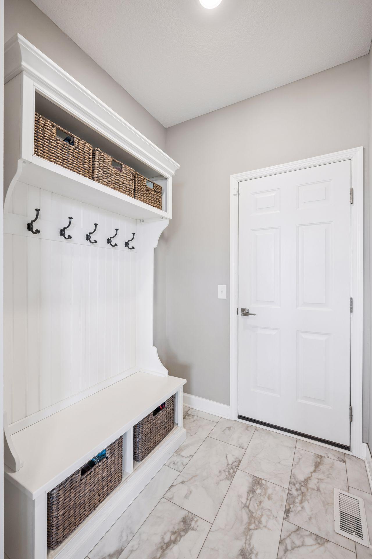 Mudroom with tons of storage clost wit built ins