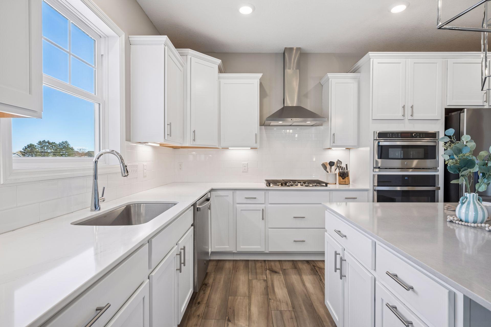 Quartz countertops, tile backsplash