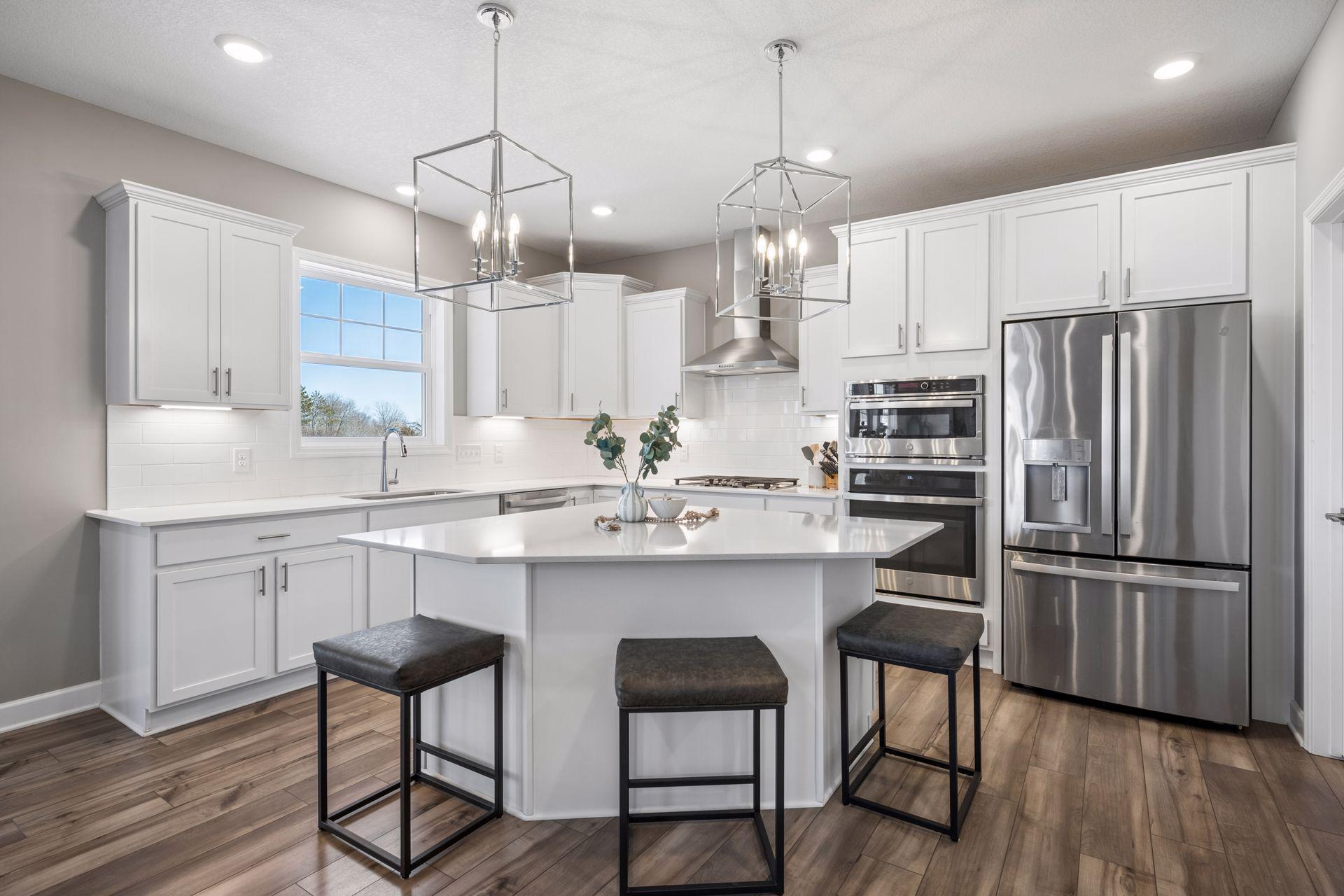 Large center island, DBL oven, Tile backsplash