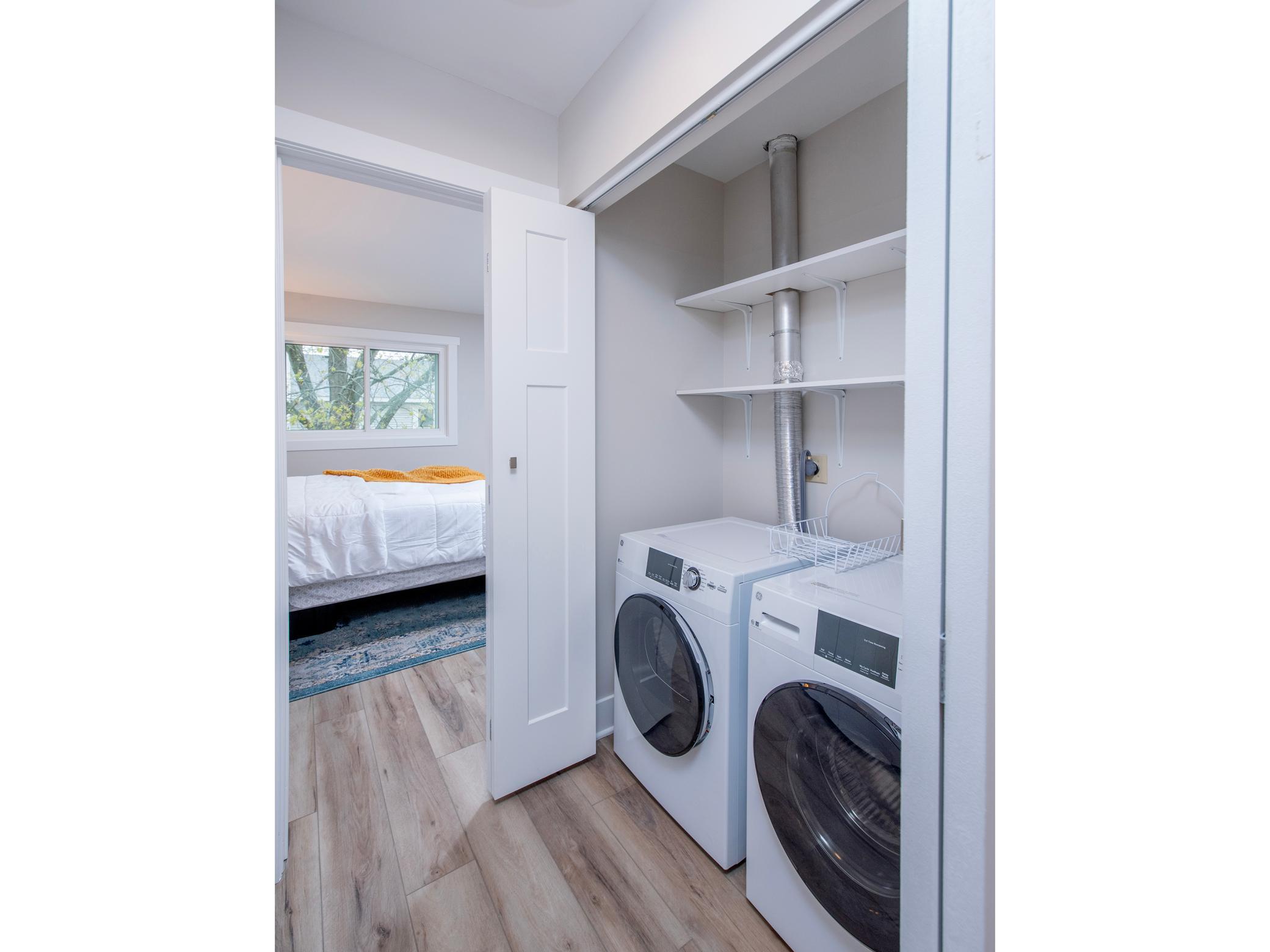 In unit new washer and dryer with good shelving space