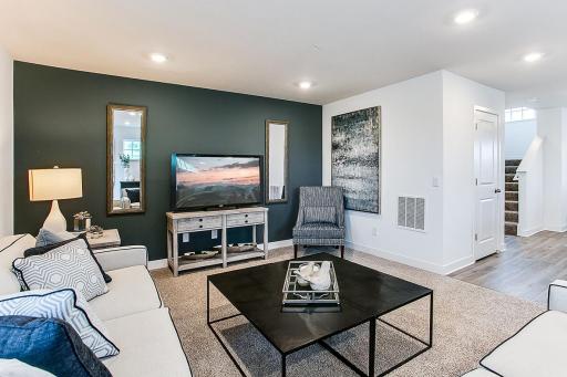 Spacious enough to host game night, but perfect for movie night! Please note, this home WILL include an electric fireplace. *Model home, colors and selections will vary.