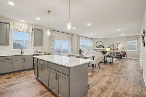 The kitchen is one of performance, and will feature Quartz countertops, stunning backsplash, durable flooring, a HUGE walk-in pantry & stainless appliances. Just an awesome set-up! Photo of model home, color and options will vary.