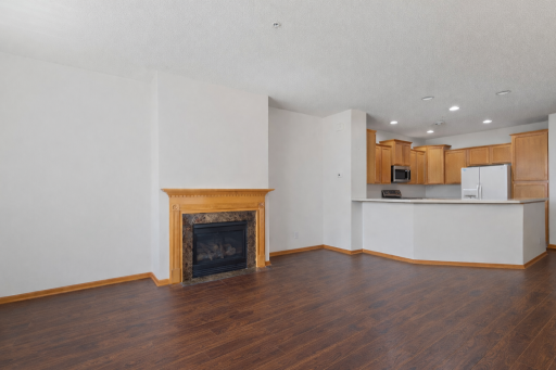 You will love the cozy gas fireplace and updated flooring throughout the main!