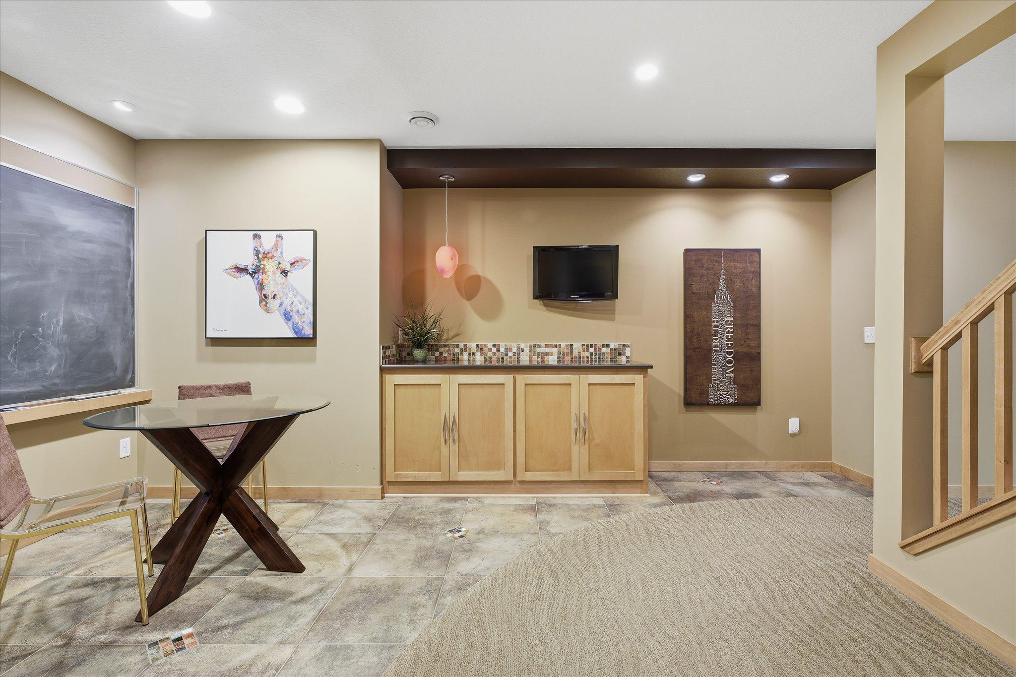Lower level nook with built in maple storage cabinetry.