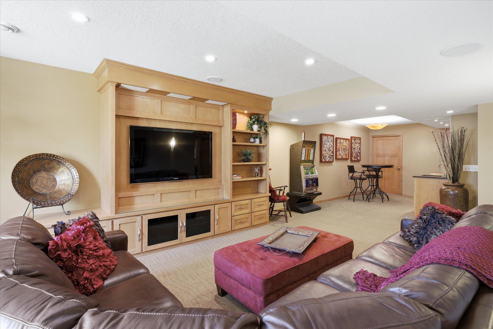 The lower level is designed for entertaining with built in Maple wood media center, surround sound and a wet bar.