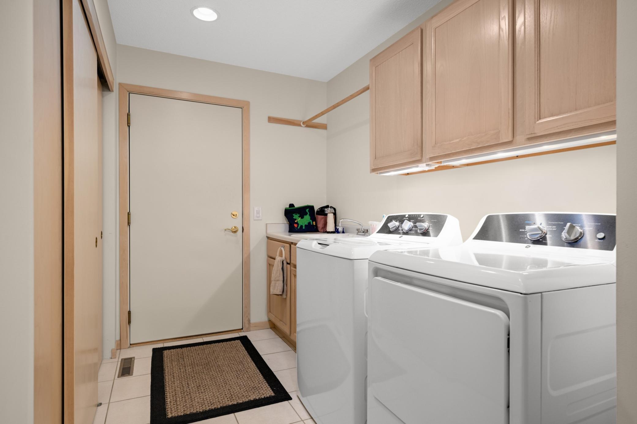 The main floor laundry offers a full-size washer and dryer, a sink, plenty of closet place and accesses the attached double garage with no steps.