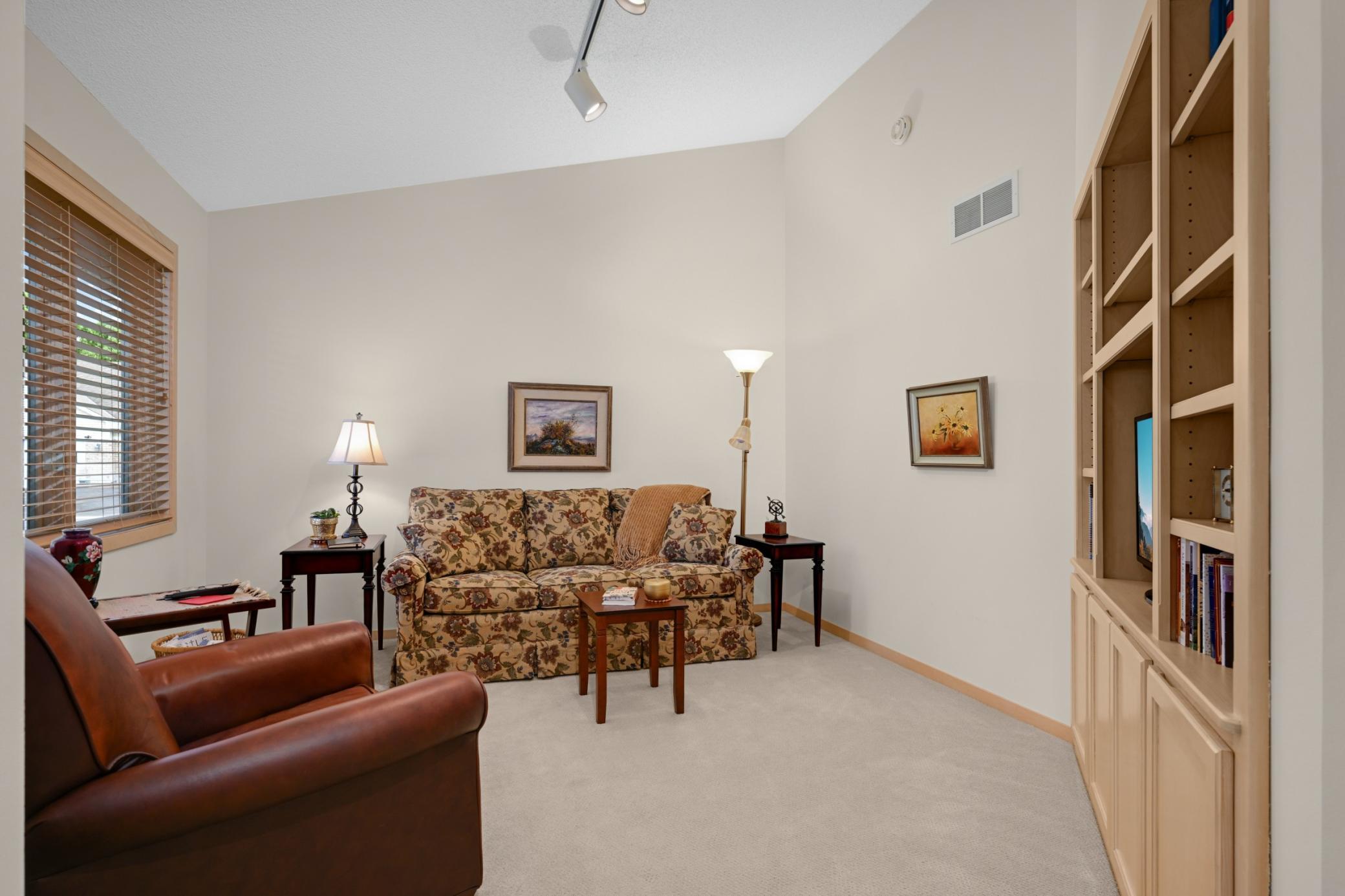 Main floor den with a nice sized built-in bookcase