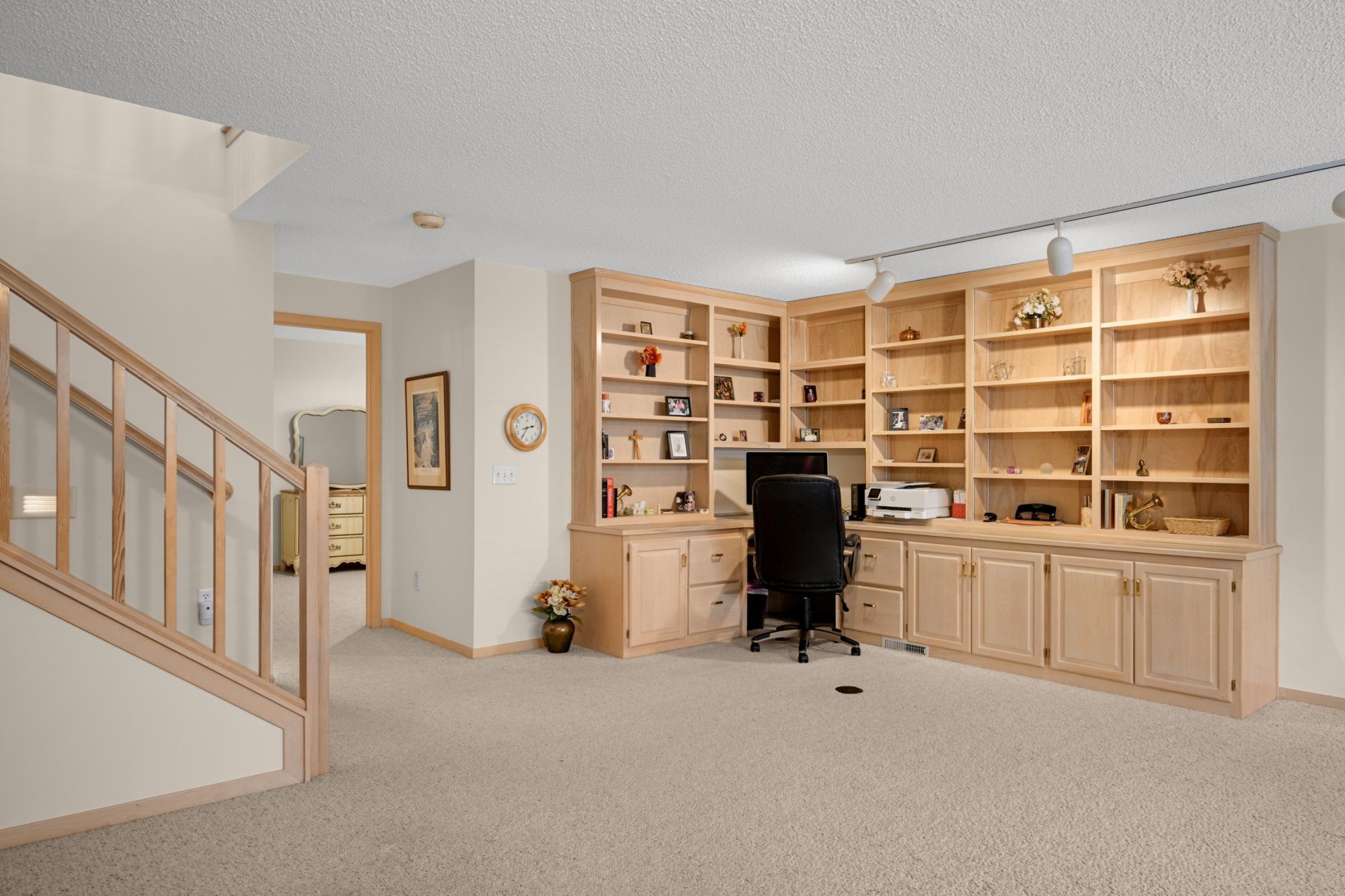 The lower level offers a large family room with a wonderful built-in bookcase and desk area.