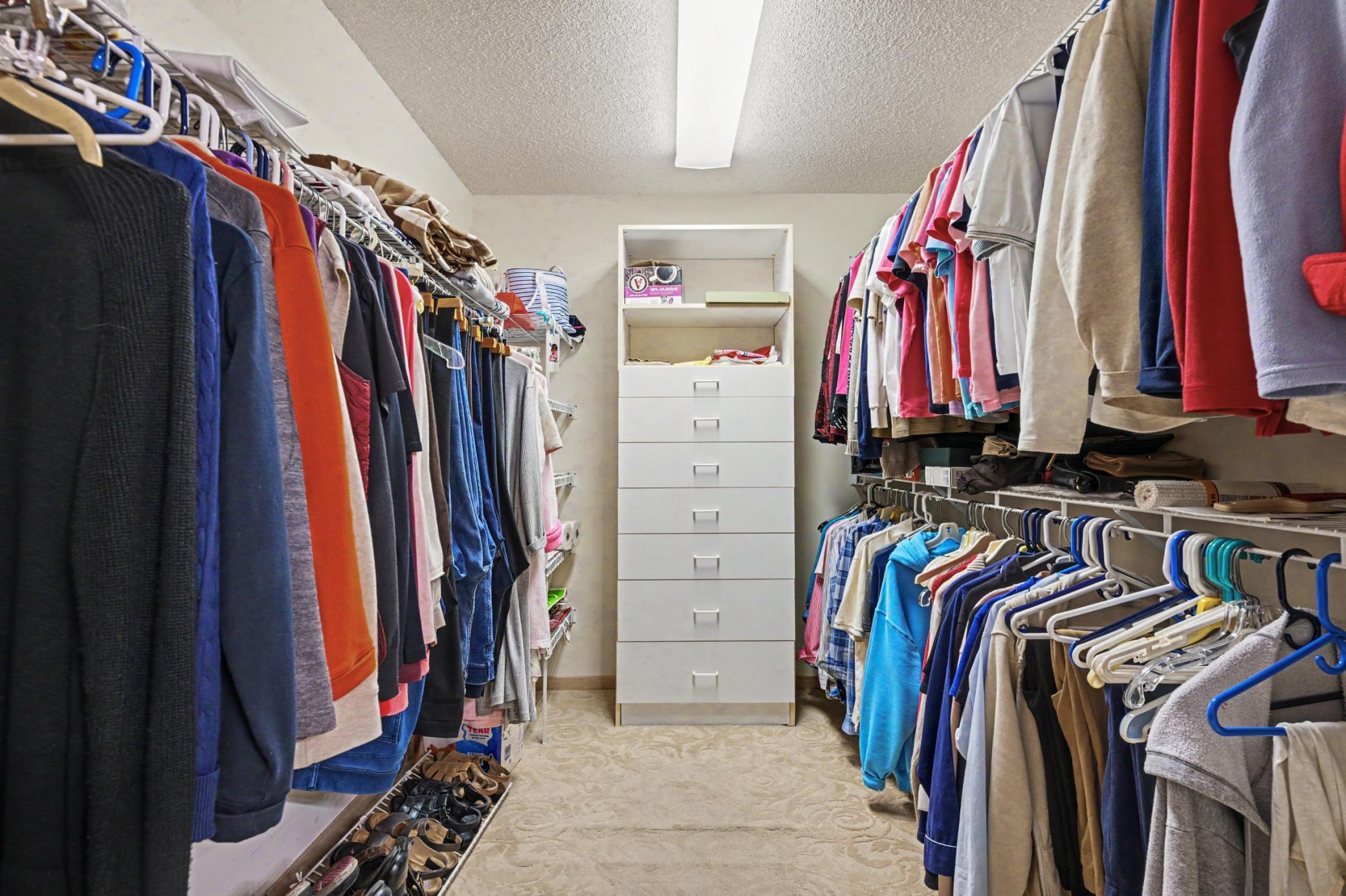 The spacious walk-in primary closet