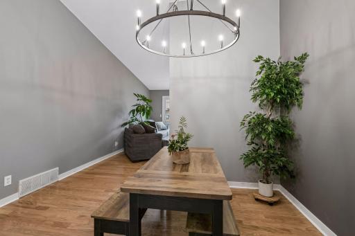 Bright dining room with updated light fixture.
