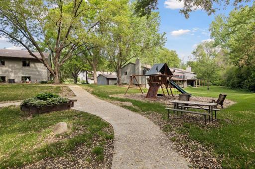 Walking trails lead to playground, picnic area, and a community fire pit.