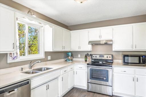 Open and Bright Kitchen with granite countertops