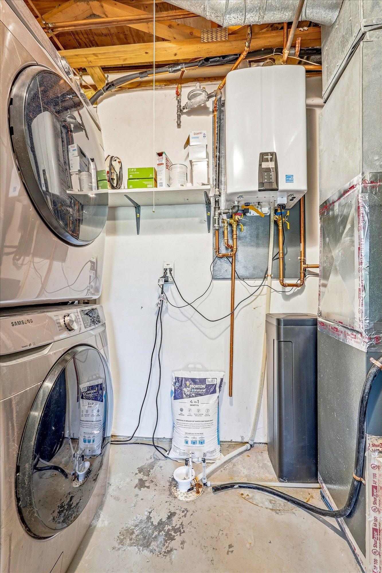 Laundry space. Tankless water heater making hot showers on demand