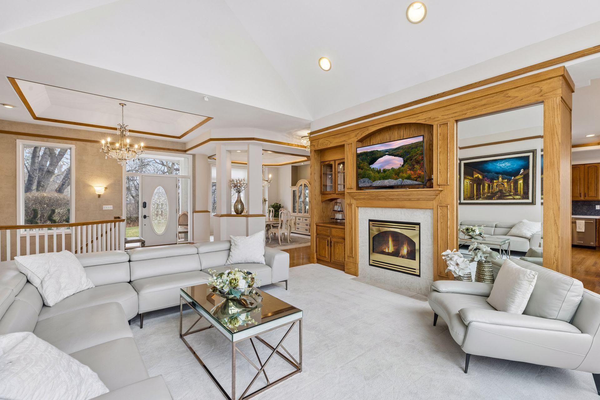 A thoughtfully designed home that showcases custom built-ins, which frame a cozy gas fireplace, creating a stunning focal point and warm gathering area.