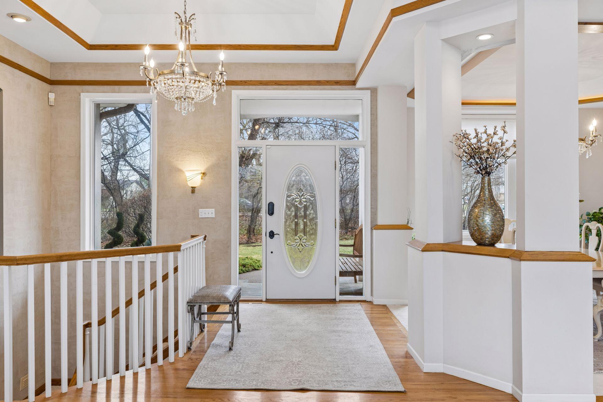 An elegant and welcoming entry sets the tone for this beautifully designed home, where rich hardwood floors and refined architectural details create a lasting first impression.