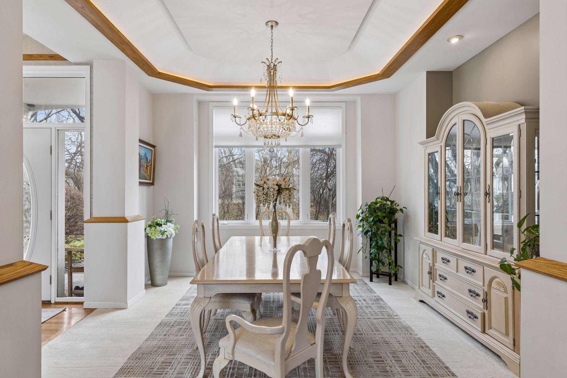 Elegant tray ceiling with crown molding and integrated accent lighting.