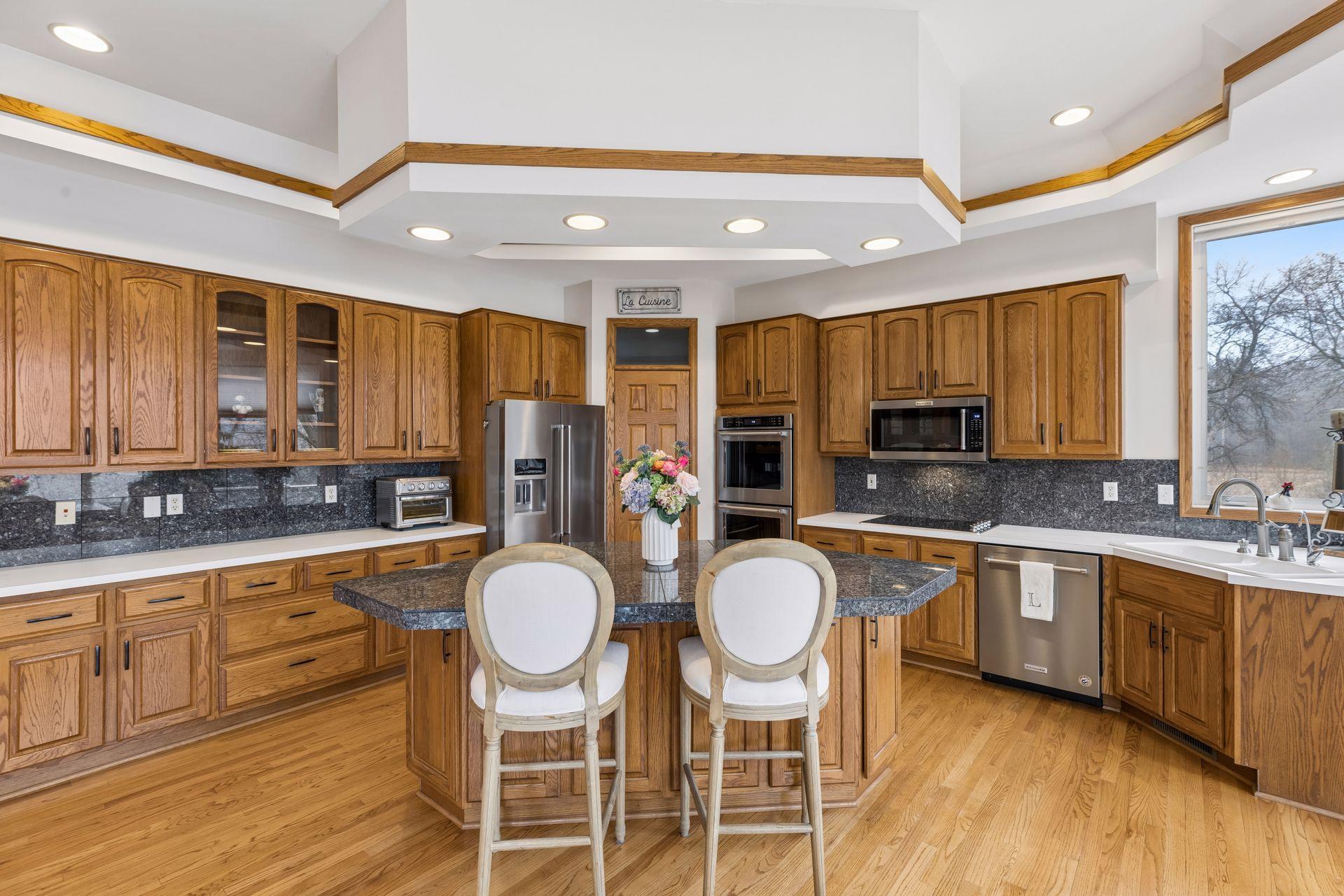 A well laid out kitchen with center island, double ovens, huge pantry and tons of counterspace.