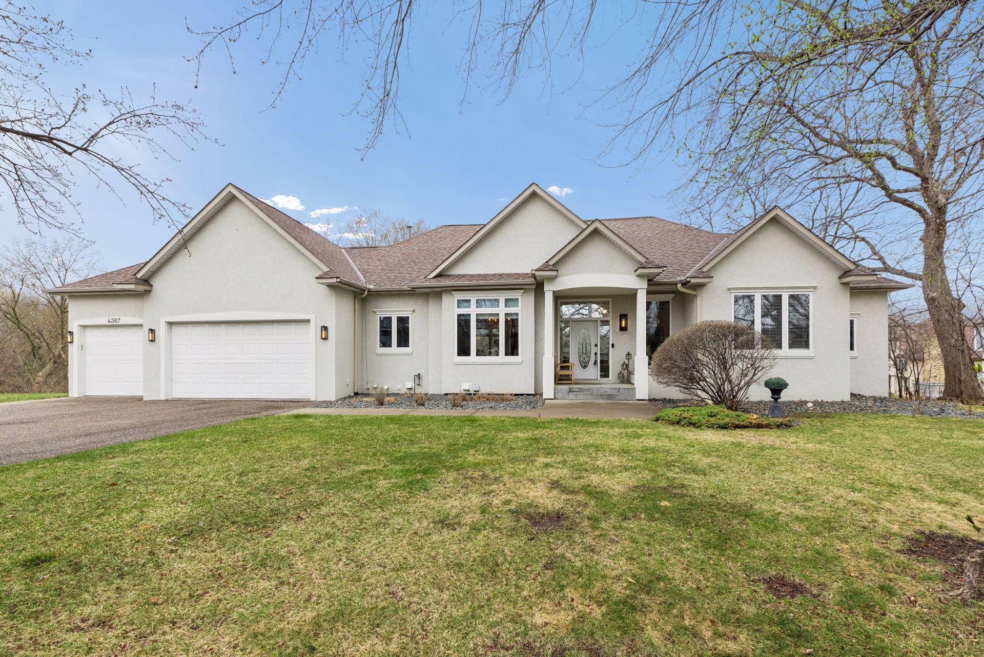 Welcome home to 4367 Lexington Ave N. A home with exceptional curb appeal, spectacular floorplan, and amazing setting on Karth Lake.