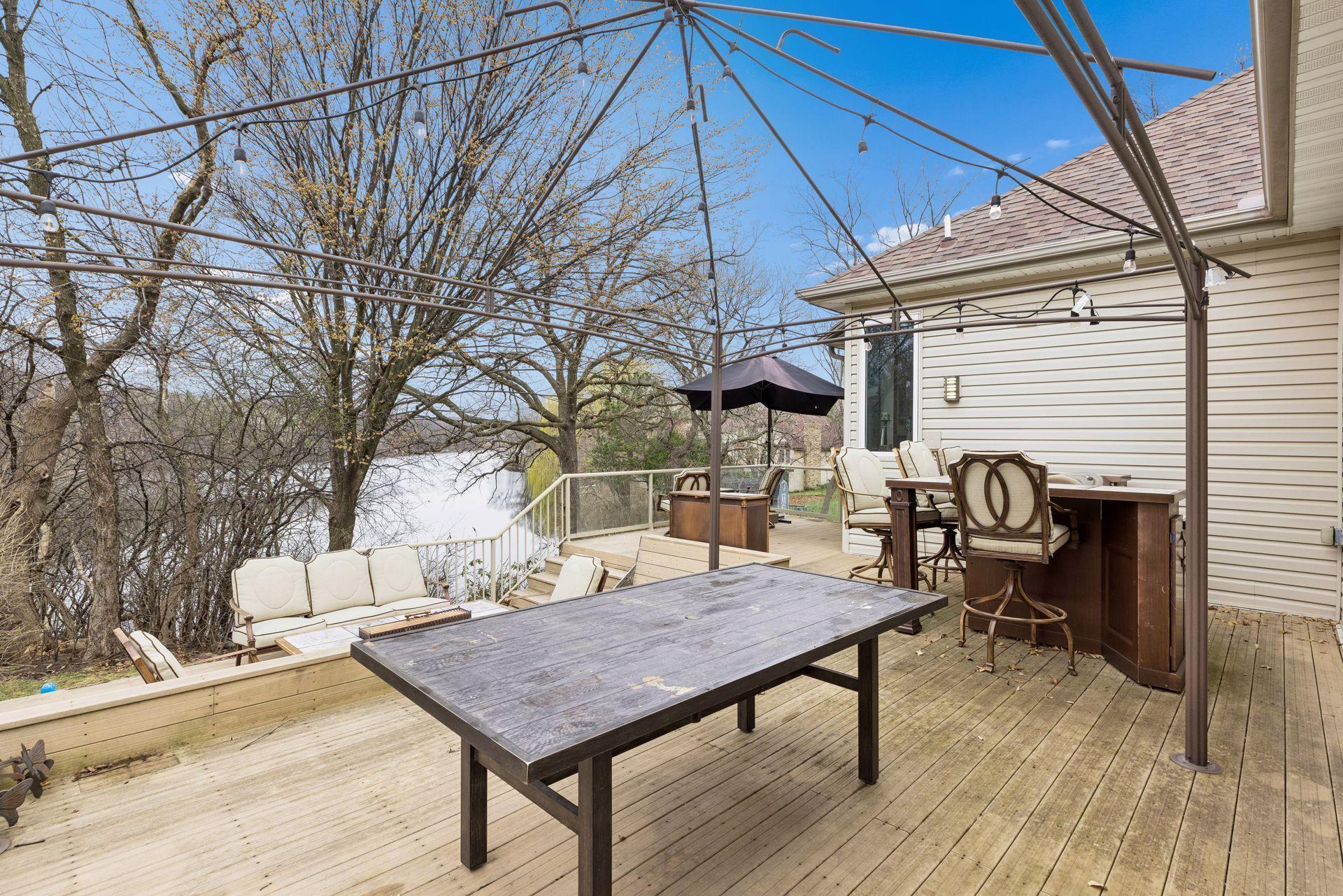 Thoughtfully arranged with separate seating areas, a dedicated dining space, and an outdoor bar area, it creates the perfect setting for hosting gatherings or unwinding in a private retreat.