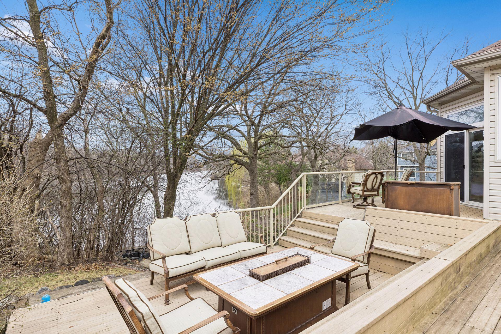 Overlooking the tranquil waters of Karth Lake, the elevated design captures peaceful views and a sense of connection to nature, making this outdoor living space a true extension of the home.