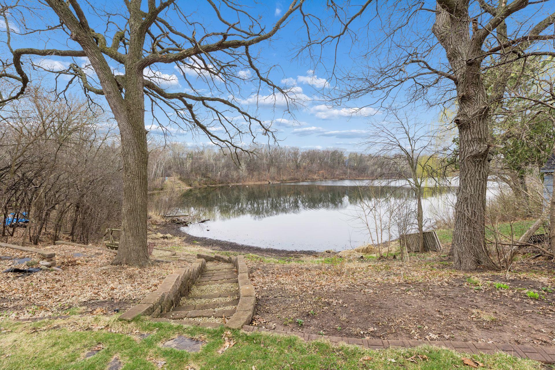 A rare and peaceful setting, this picturesque Karth lakeshore offers a truly tranquil retreat right in your own backyard. Enjoy sweeping water views framed by mature trees, creating a private and serene backdrop in every season.