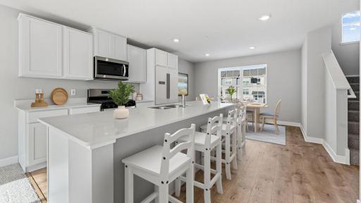With a gas range, vented microwave fan, and large entertaining island, this kitchen is a chef's dream! *Model home, colors and selections will vary.