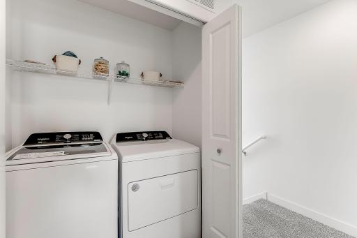 The upper-level laundry nook means at least one chore just got easier! *Model home, colors and selections will vary.