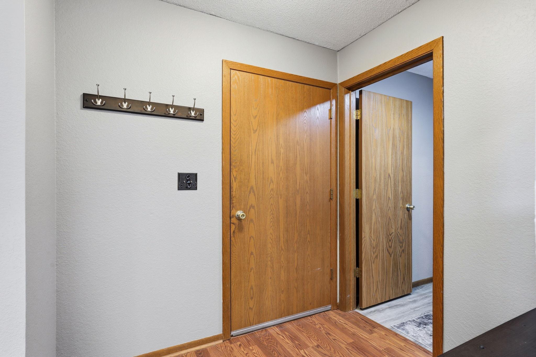 Foyer with powder room off to right